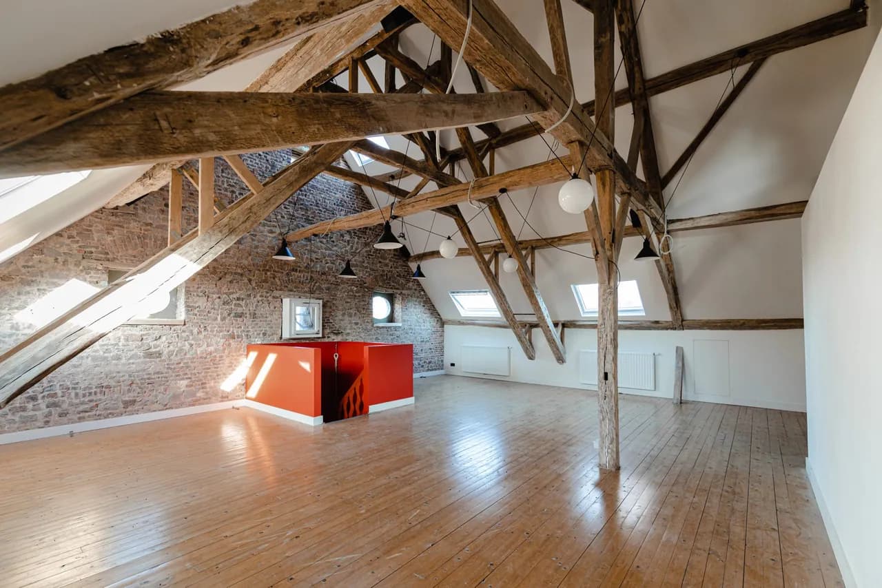Event room under the rafters at Château de la Louveterie