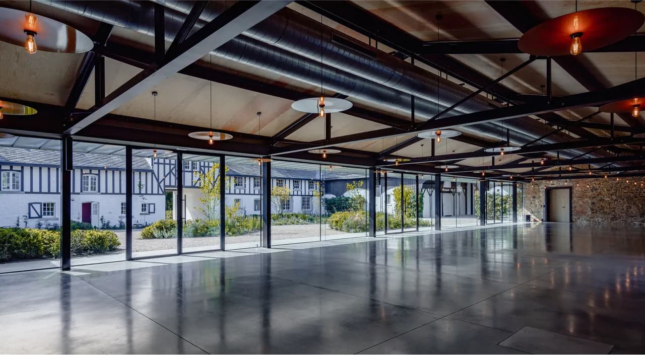 Glass-roofed reception hall at Domaine de Bronromme